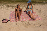 Two women relaxing on a Nakie XL beach towel Nakie - Australia