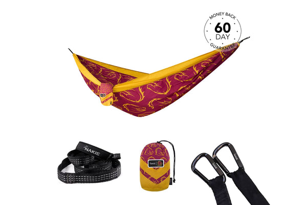 Burgundy and gold patterned camping hammock with yellow straps, shown with black carabiners and matching stuff sack