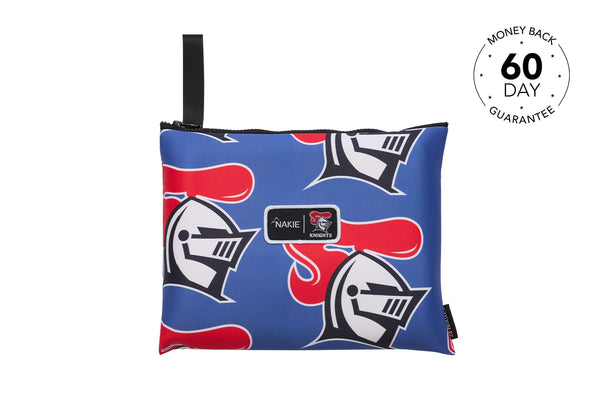 Blue recycled beach towel with red and white Knights helmet pattern and black carry handle