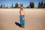 Blue abstract patterned recycled sand-free beach towel worn as wrap on beach model preview #5