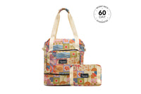 Retro Shores recycled tote bag with cream handles, multicolor patchwork beach-themed print, front pocket, and matching pouch.