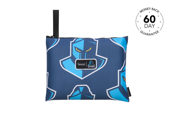 Titans NRL recycled sand-free beach towel in navy blue with bright blue shield logo pattern and black carry handle