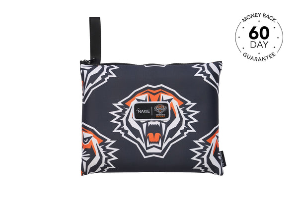 Navy beach towel with white and orange tiger head print, black carry handle and Nakie branding.